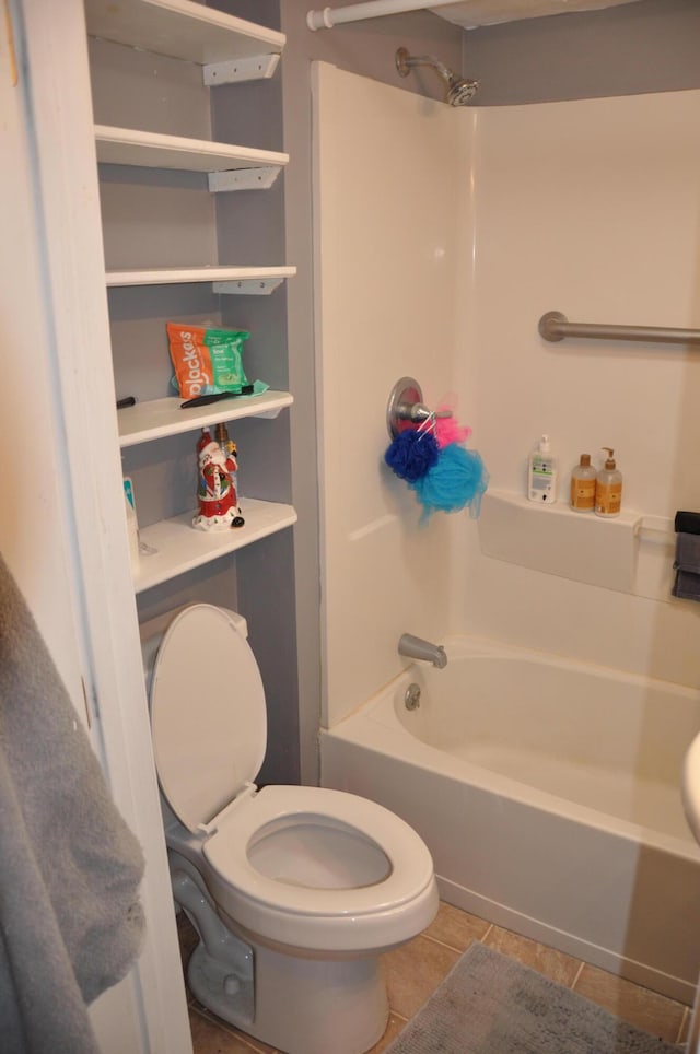 full bath with shower / bath combination, toilet, and tile patterned flooring