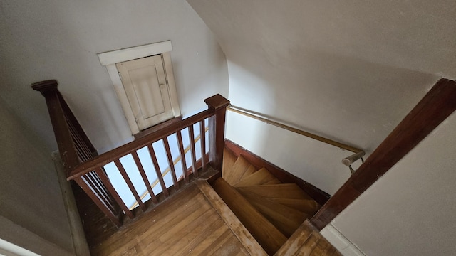 staircase featuring wood finished floors