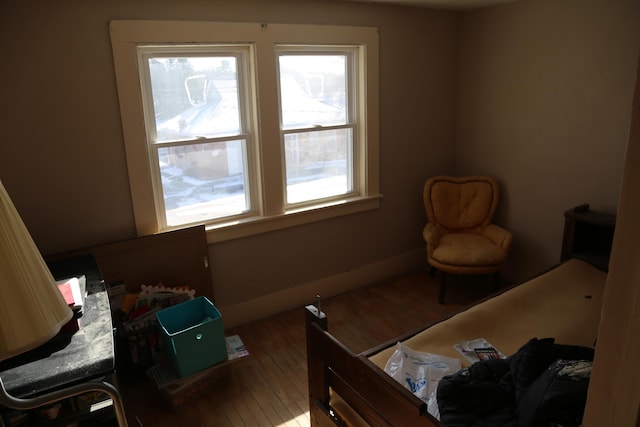 bedroom with wood finished floors