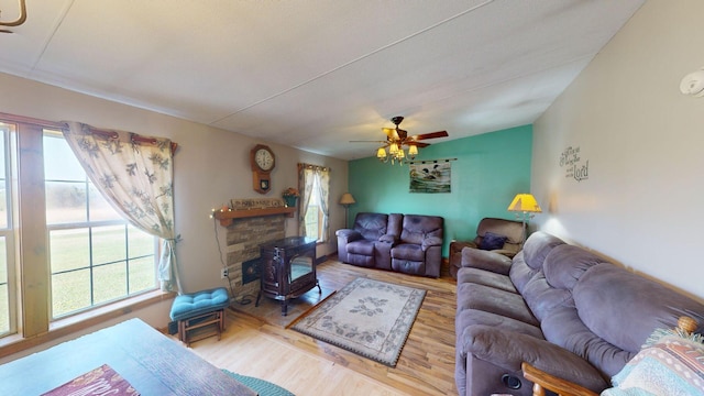 living room with ceiling fan and wood finished floors