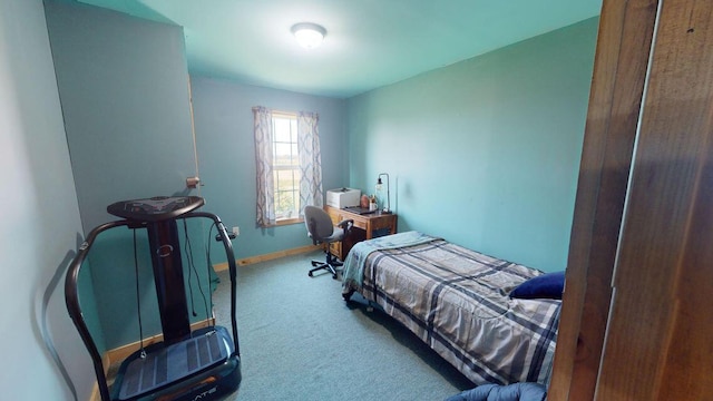 carpeted bedroom with baseboards