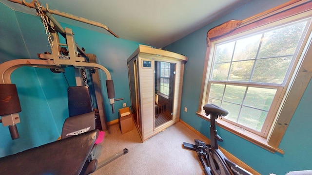 workout room with carpet floors and baseboards