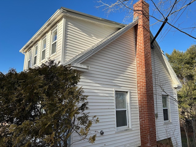 view of side of property with a chimney