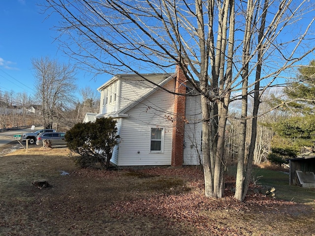 view of home's exterior featuring a chimney