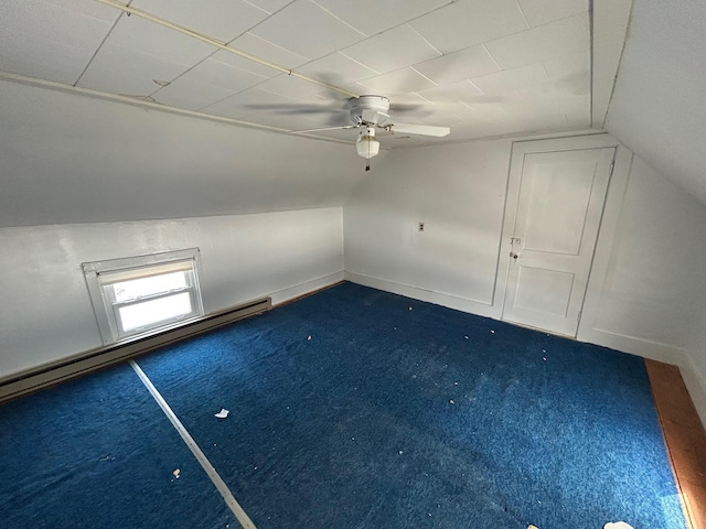 bonus room featuring baseboards, ceiling fan, a baseboard radiator, vaulted ceiling, and dark carpet