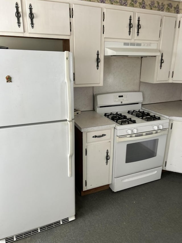 kitchen with light countertops, white appliances, white cabinets, and under cabinet range hood