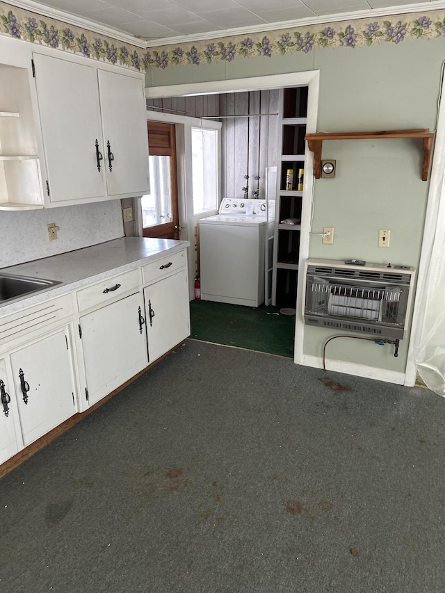 kitchen featuring heating unit, light countertops, dark colored carpet, white cabinetry, and open shelves