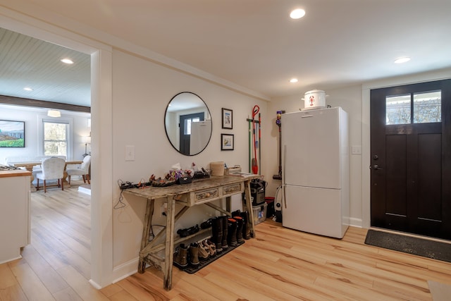 foyer featuring recessed lighting, baseboards, and light wood finished floors