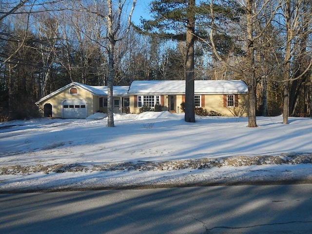 single story home featuring an attached garage