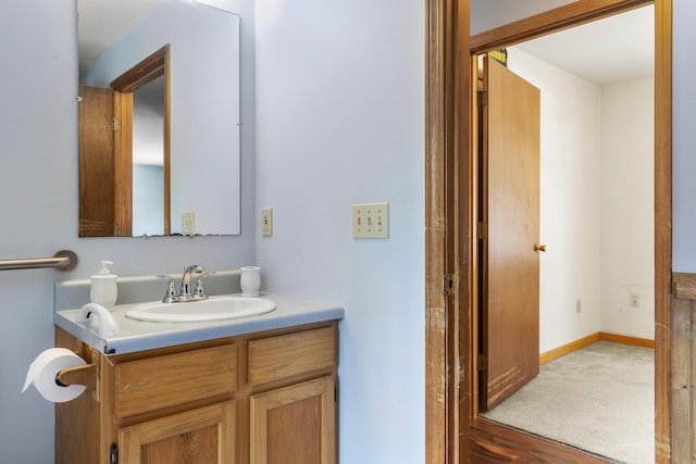 bathroom with baseboards and vanity