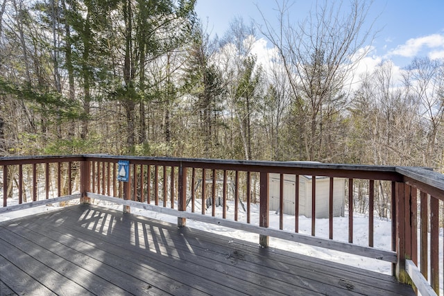 wooden deck with a forest view