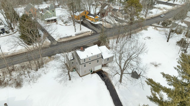 snowy aerial view featuring a residential view