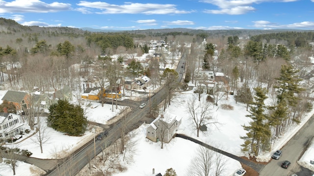 snowy aerial view with a residential view