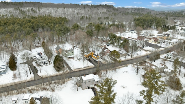 snowy aerial view featuring a residential view