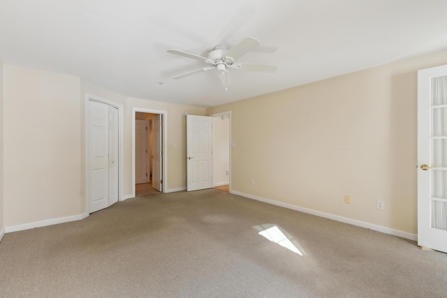 unfurnished bedroom with carpet flooring, ceiling fan, and baseboards