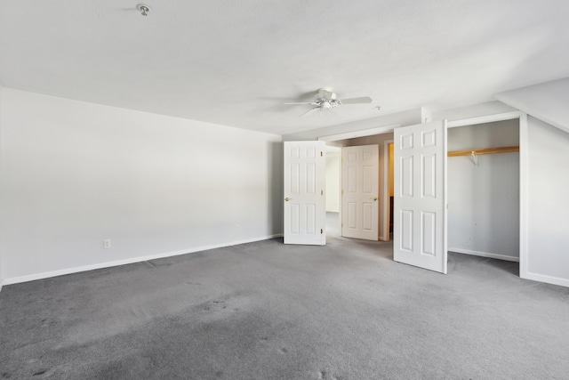 unfurnished bedroom with a closet, carpet, a ceiling fan, and baseboards