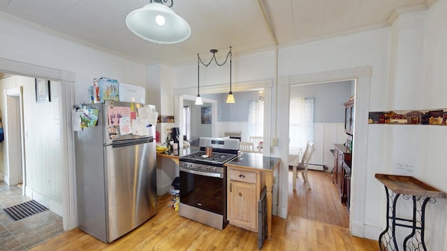 kitchen featuring pendant lighting, stainless steel appliances, baseboard heating, light wood-style floors, and ornamental molding