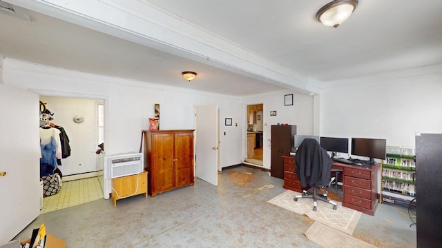 home office featuring finished concrete floors, a baseboard heating unit, and a wall mounted air conditioner