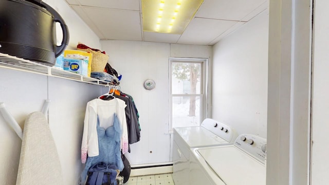 laundry room with laundry area, tile patterned floors, baseboard heating, and independent washer and dryer