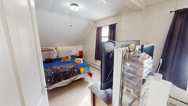 bedroom with vaulted ceiling, carpet floors, and baseboard heating