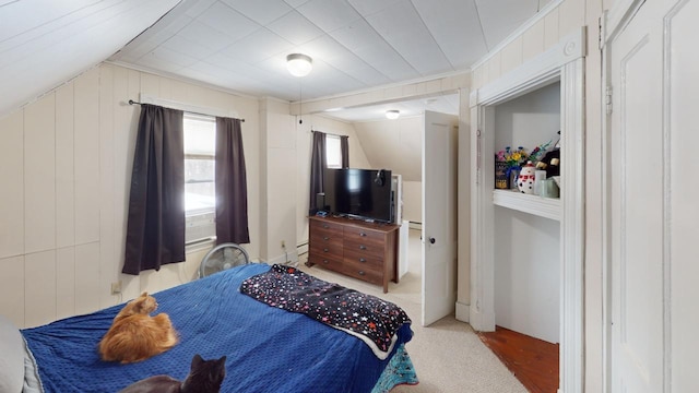 bedroom featuring lofted ceiling, carpet, and crown molding