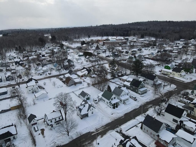 snowy aerial view featuring a residential view