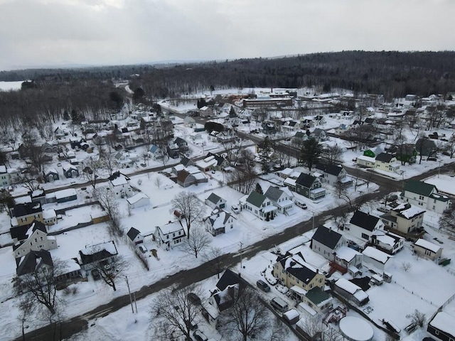 snowy aerial view featuring a residential view