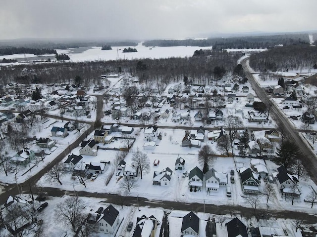 snowy aerial view with a residential view