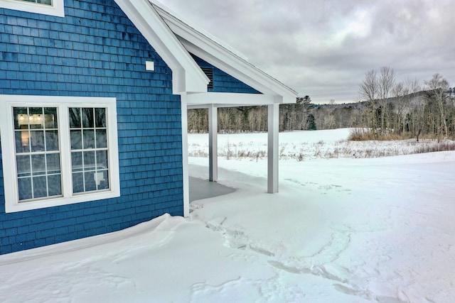 view of yard layered in snow