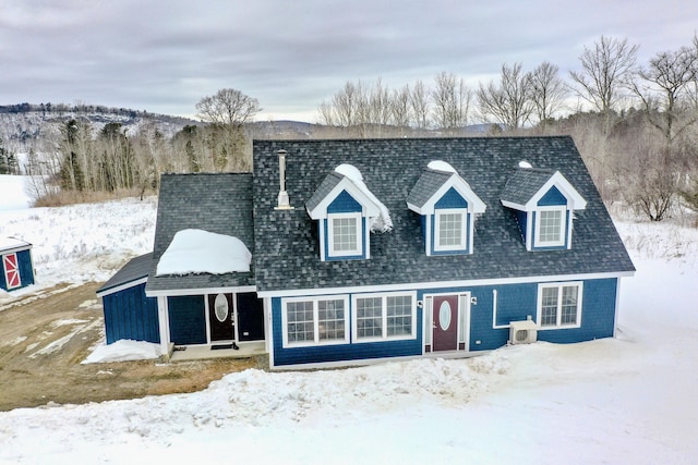 view of front of home featuring roof with shingles