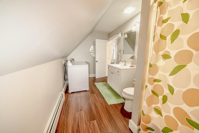 full bathroom featuring toilet, wood finished floors, baseboard heating, vaulted ceiling, and vanity