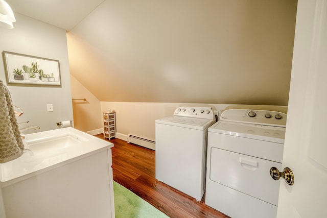 clothes washing area featuring laundry area, a baseboard radiator, wood finished floors, independent washer and dryer, and a sink