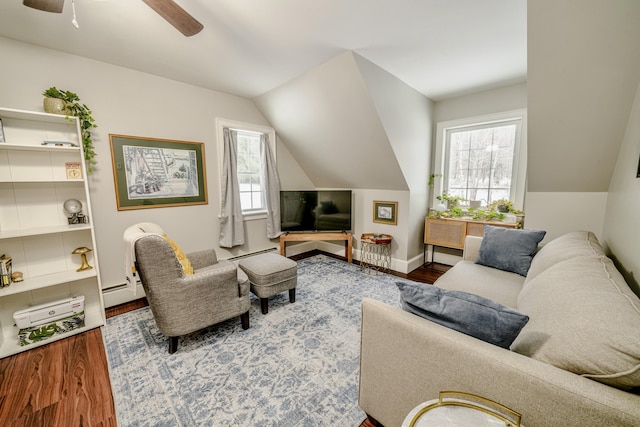 living area featuring lofted ceiling, a baseboard radiator, ceiling fan, and wood finished floors