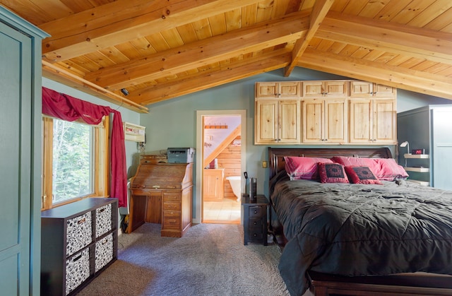 bedroom with dark carpet, wood ceiling, vaulted ceiling with beams, and ensuite bathroom