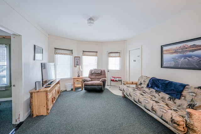 carpeted living room featuring baseboards