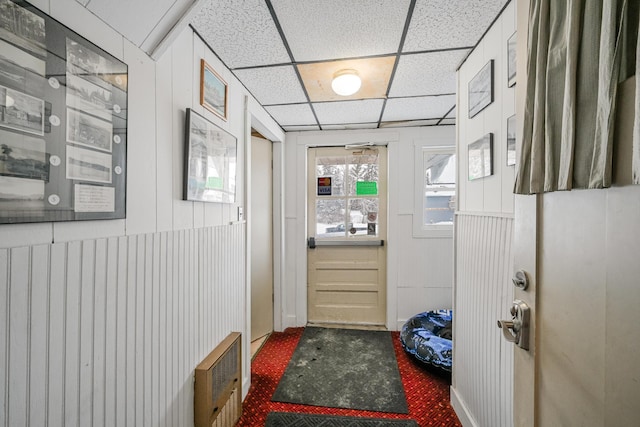 entryway featuring a drop ceiling and heating unit