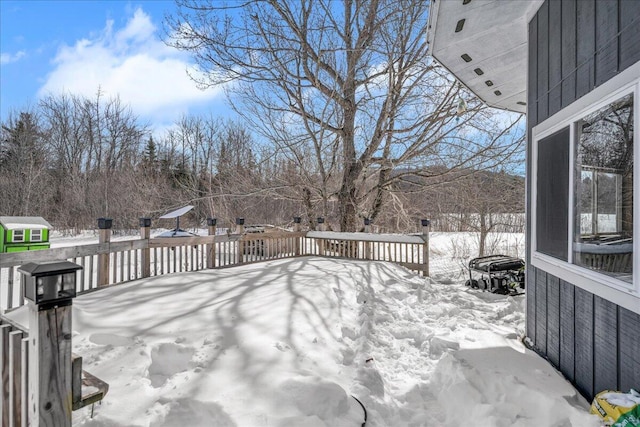 view of snow covered deck