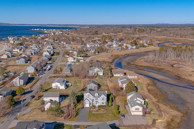 birds eye view of property with a residential view and a water view
