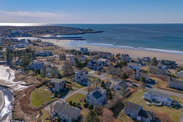 birds eye view of property with a view of the beach and a water view
