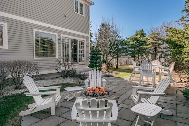 view of patio / terrace featuring a fire pit and fence