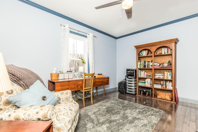 office with hardwood / wood-style flooring, baseboards, ornamental molding, and ceiling fan