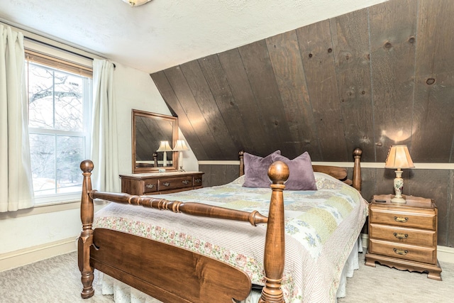 carpeted bedroom with multiple windows and baseboards