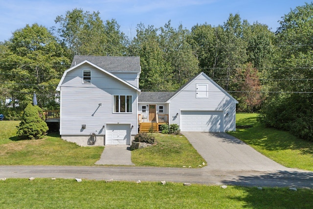 view of front of property with a garage, a front yard, and driveway