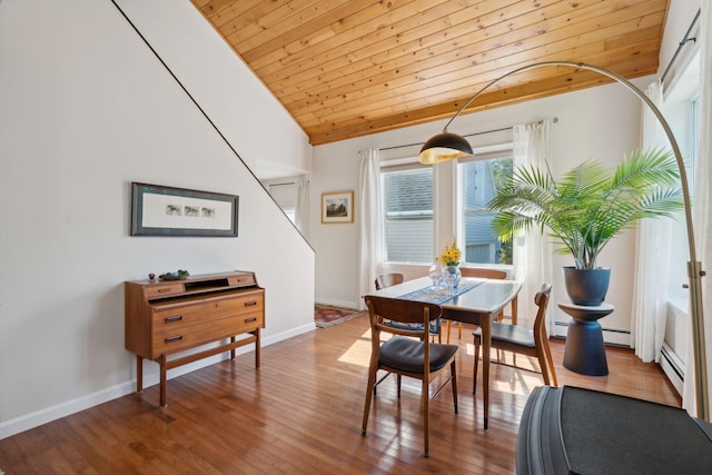 dining area with wood ceiling, baseboards, vaulted ceiling, baseboard heating, and hardwood / wood-style floors