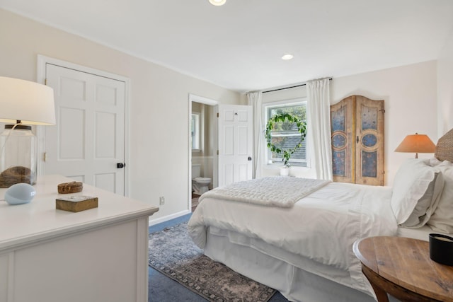 bedroom with carpet floors, recessed lighting, ensuite bath, and baseboards