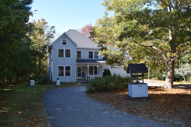 view of front of property featuring roof with shingles