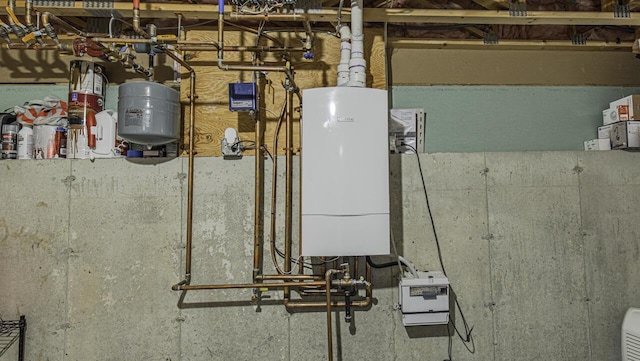 utility room featuring water heater