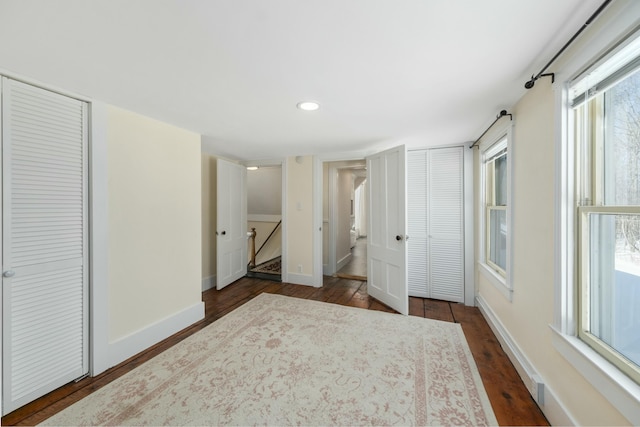 bedroom with dark wood-type flooring, recessed lighting, and baseboards