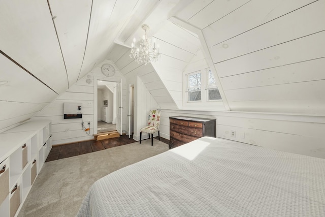 bedroom with wooden walls, dark wood-style floors, heating unit, vaulted ceiling, and a notable chandelier