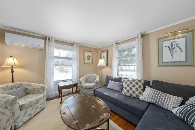 living room with a wall mounted AC, wood finished floors, and crown molding